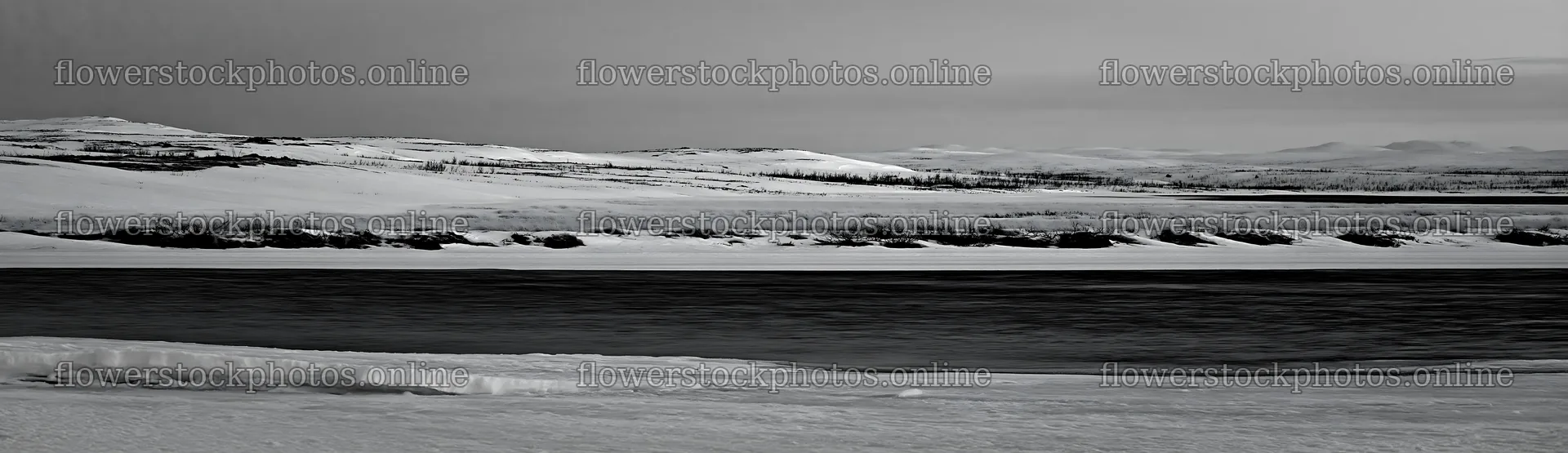 Snowy highland meadow with river in black and white – flower stock photos 14762x4268