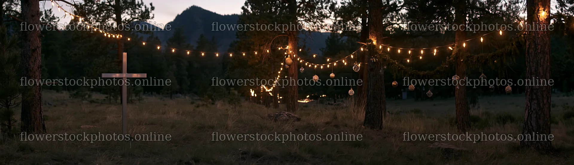 White Christian cross in remote meadow surrounded by lights – flower stock photos 14762x4268